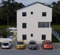 Parking lot by a 4-room apartment in Mandre with five cars in front of a white building.