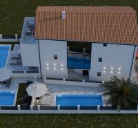 Exterior of a 4-room apartment in Mandre with a garden, pools, and parking spaces.