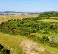 Aerial view of development plots near Kúty in Prešov, surrounded by greenery and fields.