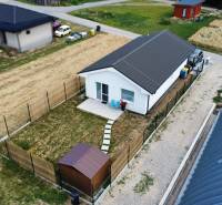 A family house in Nižná, with a yard, a garden house, and a driveway in a natural setting.