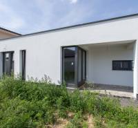 A family house in Zohor with a white facade and a garden in the exterior.