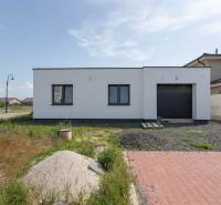 A family house in Zohor with a garden, garage, and driveway in a quiet suburb.