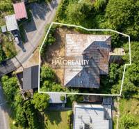 An aerial view of an older building surrounded by greenery in Hodruša-Hámre.