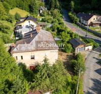 An aerial view of a building in the commercial area of Hodruša - Hámre surrounded by greenery.