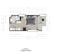 Floor plan of a studio apartment with one bedroom, kitchen, and balcony under construction in an apartment building.