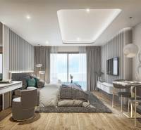 Luxury bedroom with ocean view within the apartment development.