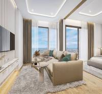 Living room of a 2-room apartment with a sea view, featuring a comfortable couch and a television.