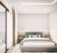 A bedroom in a 2-room apartment with a view of the Pattaya city skyline.