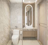 Bathroom in a 3-room apartment with modern sanitary equipment and illuminated mirror.