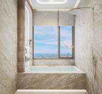 Luxury bathroom with a bathtub, large window, and a view from a three-room apartment.