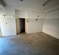 Commercial premises with tiled walls, empty room.