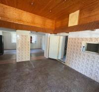Wooden ceiling and tiled wall in commercial premises.