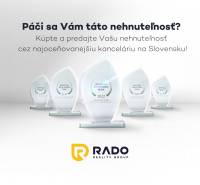 The image shows the awards of the real estate agency RADO Real Group on Žabotova Street.