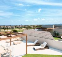A terrace with a view of RODA, seating, loungers, and greenery in a 4-room apartment.