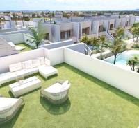 A terrace with a view of the pool, surrounded by greenery, belonging to a 4-room apartment in Rode.