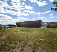 Land for residential use near Svetlá Street in Košice-Barca, grassy area with a garage.