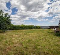 A grassy plot surrounded by trees on Svetlá Street, Košice - Barca district. Land - residential.
