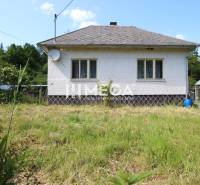 A family house in Nižná Jablonka with a grassy plot and a satellite dish on the roof.