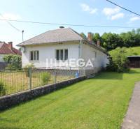 A family house in Nižná Jablonka with an adjacent garden and grassy land.