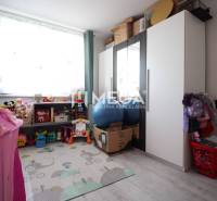 Children's room in a 3-room apartment with toys, a wardrobe, and a small tent.