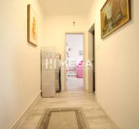 A hallway in a 3-room apartment with decorations and wall paintings.
