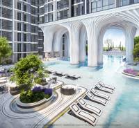 Apartment construction in Pattaya: pool, loungers, greenery, modern architecture, exterior, sunny location.