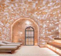 Relaxation loungers in a room with a vaulted marble ceiling in the apartment construction.