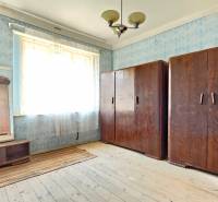 A room with old wooden cabinets and blue wallpaper, Properties - living.