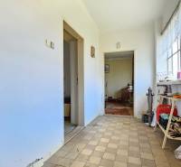 A hallway in the interior with older furniture and tiled flooring, Real estate - living.
