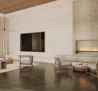 Luxurious interior of a family house with a fireplace and comfortable seating.