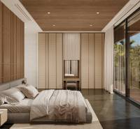 Bedroom in a family house with a large window, wooden panels, and a bed.