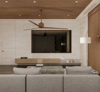 Living room in a family house with a comfortable sofa and a TV on the wall.