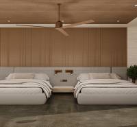 Interior of a family house with two beds, a ceiling fan, and a decorative panel.