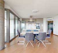 Stylish 4-room apartment with a dining table and panoramic windows.