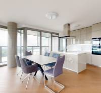 A kitchen in a 4-room apartment with a dining table and a panoramic view.