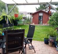 The garden of a family house on Brusnicova Street in Chorvátsky Grob with a terrace and a gazebo.