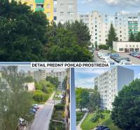 View from a one-room apartment in Trenčín on Kyjevská with surrounding greenery and apartment buildings.