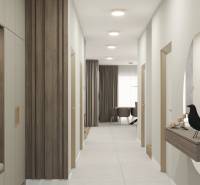 A hallway in a family house with wood and a mirror on the wall, leading to the living room.