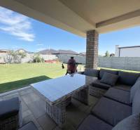A family house in Prešov with a spacious covered terrace and garden seating.