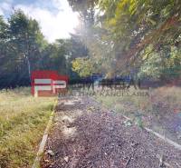 Sunny plot in Pezinok surrounded by forests, ideal for use as residential land.
