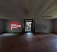 A large empty room with wooden floors and windows, Plots - housing.