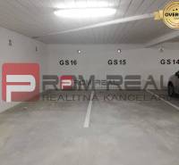 A picture from the parking lot on Slavomírova Street, offering a spot by a 2-room apartment.