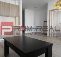 The interior of a 2-room apartment on Slavomírova Street with a kitchen and light furniture.