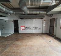 Commercial premises with tiled flooring and ventilation.