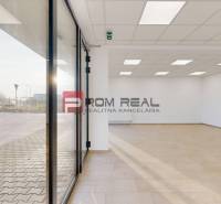 Spacious commercial spaces with large windows and modern lighting.