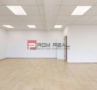 Empty commercial spaces with white walls and flooring, suitable for customization.