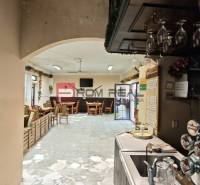 Interior of gastro spaces with furniture and a bar, dark wood, pleasant atmosphere.