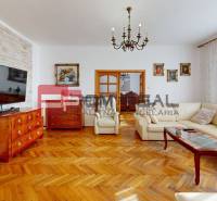 A stylish living room with an elegant sofa and wooden furniture in a family house.