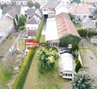 Aerial view of family houses and gardens in Trnava.