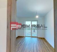 The family house has wooden floors and a French window to the garden.